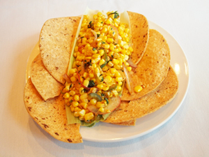 Corn and peppers on tortillas. .