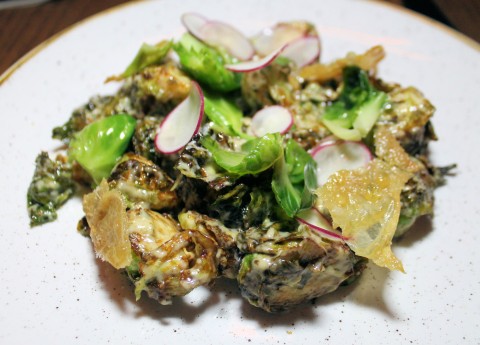 Brussels sprouts salad, with chicken skin.