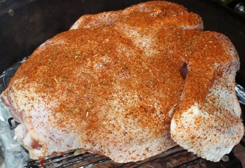 Brined turkey, seasoned for the grill.