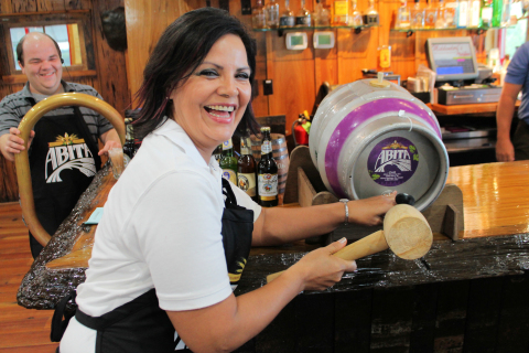Tapping into the first Oktoberfest beer barrel at Middendorf's.