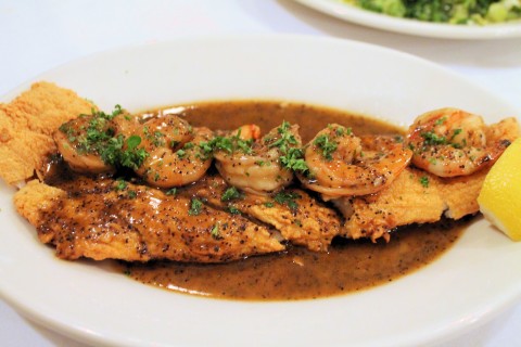 Black drum with barbecue shrimp on top.