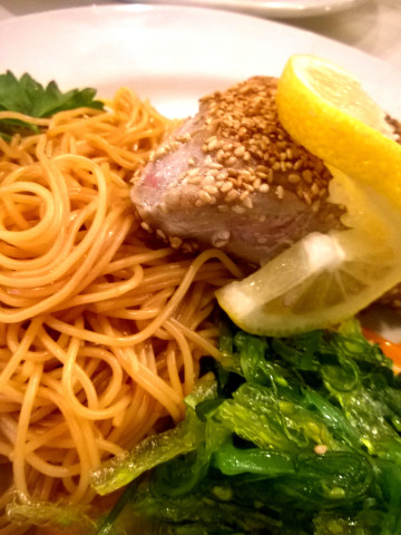 Sesame tuna with Asian noodles and seaweed.