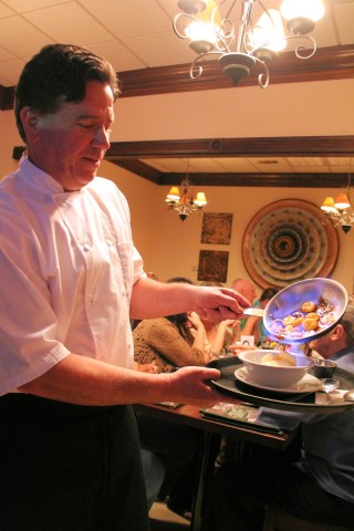 Chef Archie Saurage makes bananas Foster by hand.