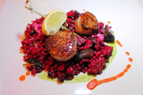Scallops with red couscous.
