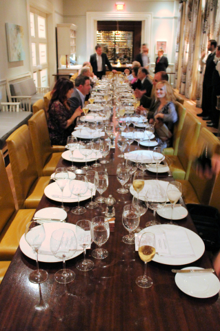 The table begins to fill at R'Evolution for the Krug Champagne dinner. Where is the tablecloth for this $250 dinner?