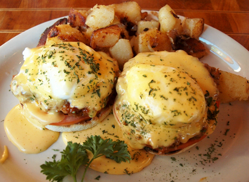Eggs Benedict with hot sausage.