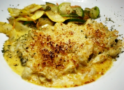 Panneed veal topped with crabmeat au gratin.