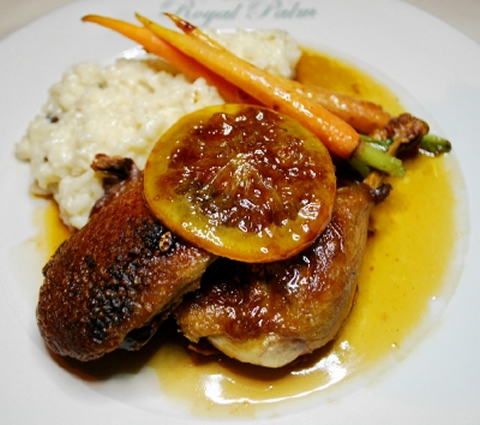 Duck with orange sauce and risotto.